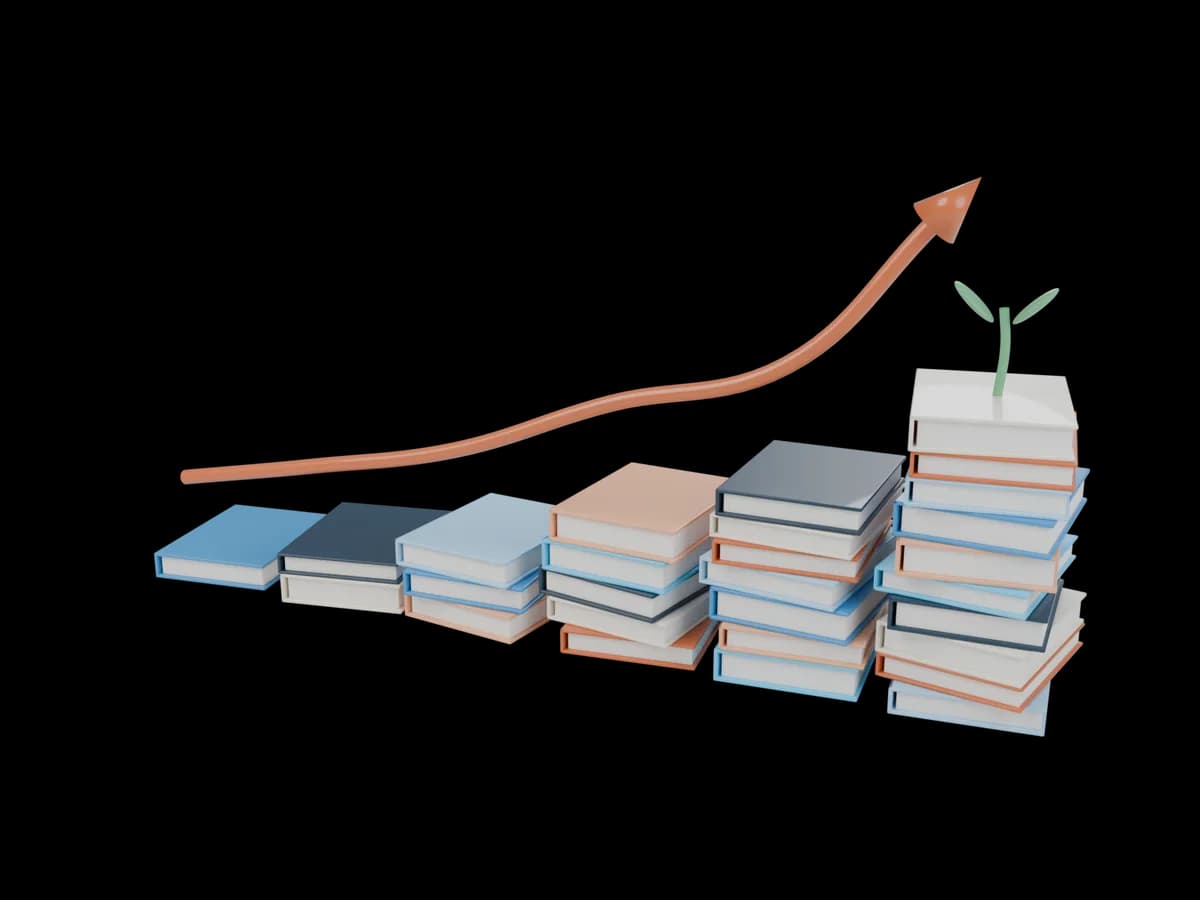 Stacks of books growing taller like a rising bar chart, with a sprout on the tallest